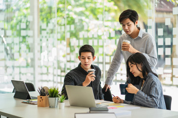 Young professional business team discussing the project together in modern office room