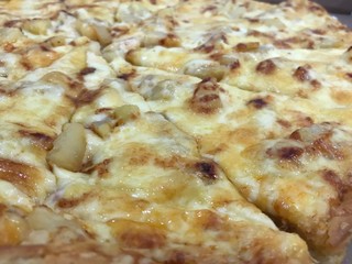 Delicious hawaiian pizza with ham and pineaple
