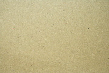 Fototapeta na wymiar Background material. A pale brown color cardboard.