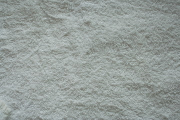 Background material. Surface of a white bath towel. macro
