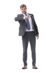 Obraz premium in full growth. serious businessman pointing to the side.