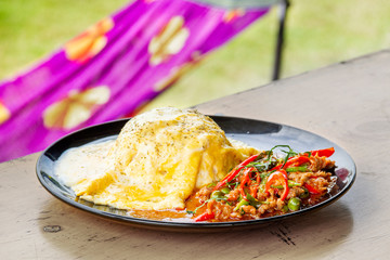 Creamy Omelet with hot and spicy beef panang curry on jusmine Rice