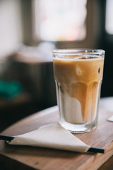 cappuccino or Latte ice coffee made from milk on the wood table in coffee shop