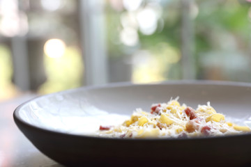 fettuccine carbonara , fettuccine pasta spaghetti with bacon ham and mushroon in white sauce italian food