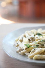 Penne pasta with white sauce and truffle , italian food