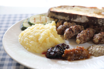 Grilled sausage with bread and potato and fruit jam sauce cuisine