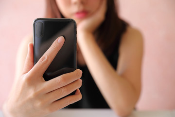 Woman hand using smart phone in selfie