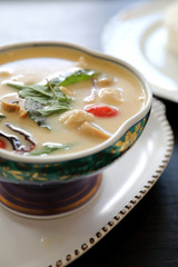 Coconut milk soup with chicken and rice , traditional Thai food