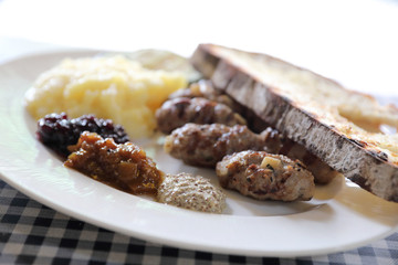 Grilled sausage with bread and potato and fruit jam sauce cuisine