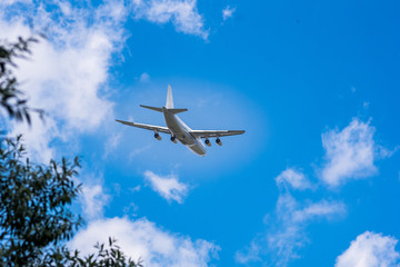 Fototapeta na wymiar huge cargo transport plane takes off in the sky