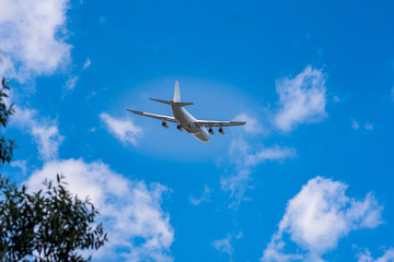 huge cargo transport plane takes off in the sky