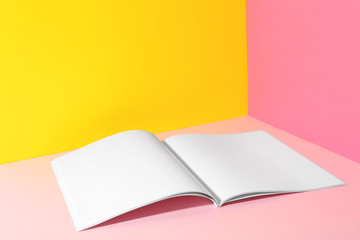 Empty book pages on color background. Mockup for design