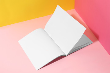 Empty book pages on color background. Mockup for design