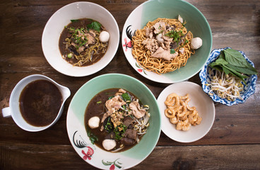 Asian noodle soup with beef meatball with fresh vegetable on wood table vintage style, asian food. Top view