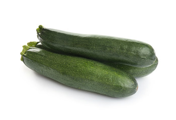 Fresh ripe green zucchinis isolated on white