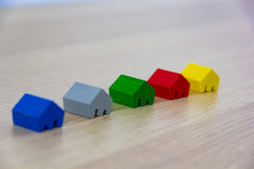 different colored game pieces representing different houses, concept of choice and diversity