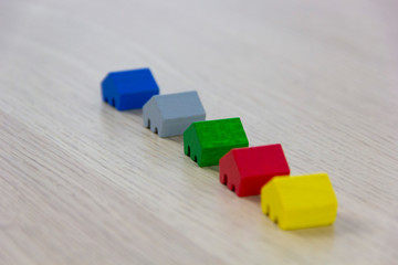 different colored game pieces representing different houses, concept of choice and diversity