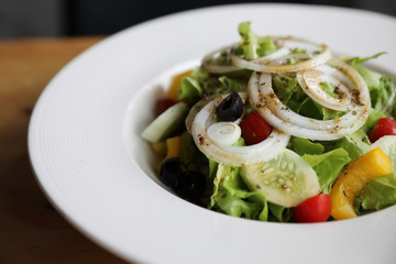 Caesar Salad on wood background
