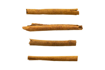 set of raw cinnamon sticks isolated on white background