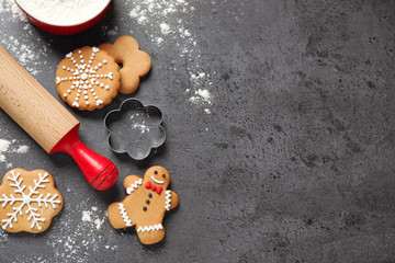 Fototapeta na wymiar Flat lay composition with tasty homemade Christmas cookies on dark grey table, space for text
