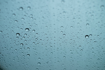 Water drops on the glass on a rainy day