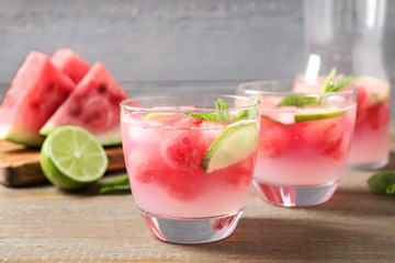 Tasty refreshing watermelon drink on wooden table