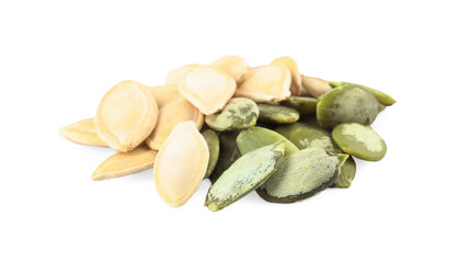 Pile of raw pumpkin seeds on white background