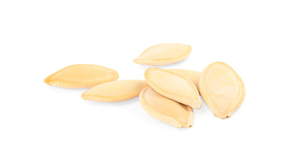 Raw unpeeled pumpkin seeds on white background