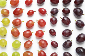 Fresh ripe juicy grapes on white background, top view