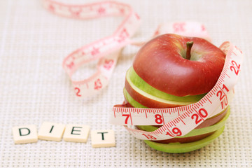 An apple and flexible ruler as a concept of dieting and weight control	