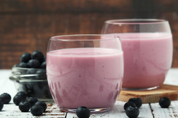 Two glasses with blueberry yogurt