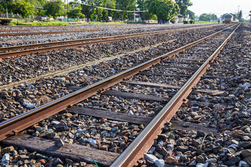 Old train or railroad tracks with wooden backing In the countryside Thailand