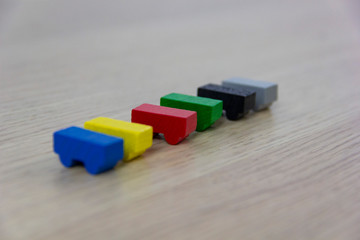 different colored game pieces representing different cars, concept of choice and diversity