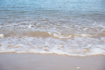 Landscape image of tropical white beach with blue sea and sky background