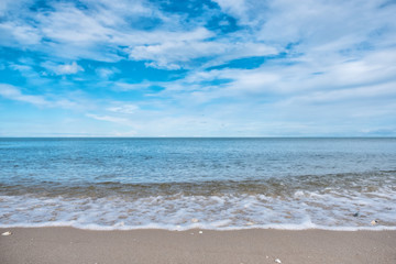 Fototapeta na wymiar Landscape image of tropical white beach with blue sea and sky background
