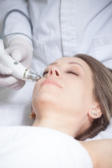 woman face skin treatment in beauty health clinic close