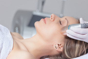 woman face skin treatment in beauty health clinic close