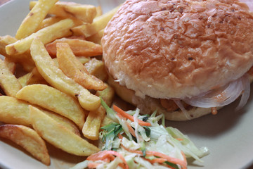 Hamburger and french fries for breakfast.Hamburger is a sandwich consisting of one or more cooked...