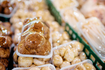Packed mashrooms on supermarket's shelf.