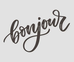 Bonjour inscription. Good day in French. Greeting card with calligraphy. Hand drawn design. Black and white. © 1emonkey