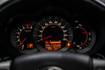Close up Instrument automobile panel with Odometer, speedometer, tachometer, fuel level.