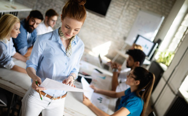 Creative business people working on business project in office