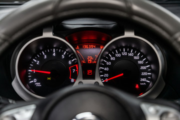 Close up Instrument automobile panel with Odometer, speedometer, tachometer, fuel level.