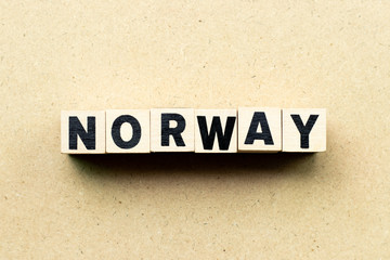 Letter block in word Norway on wood background