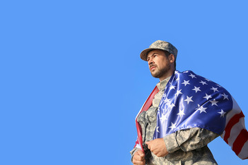 Soldier with national flag of USA outdoors