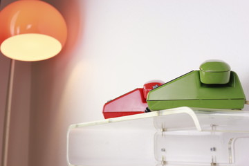 old retro telephone red green plastic isolated on white background side view front view with cable ...