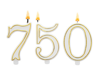 Obraz premium Burning birthday candles on white background, number 750