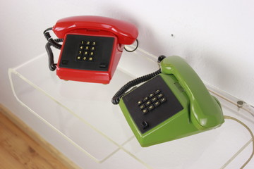 old retro telephone red green plastic isolated on white background side view front view with cable ...