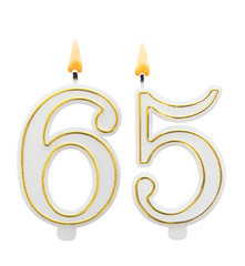 Burning birthday candles on white background, number 65