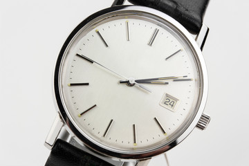 Naklejka premium classic antique silver watch swiss made used worn wristwatch isolated elegant noble retro classic luxurious front view close up Macro rare pocketwatch with black leather bracelet band strap modern lux